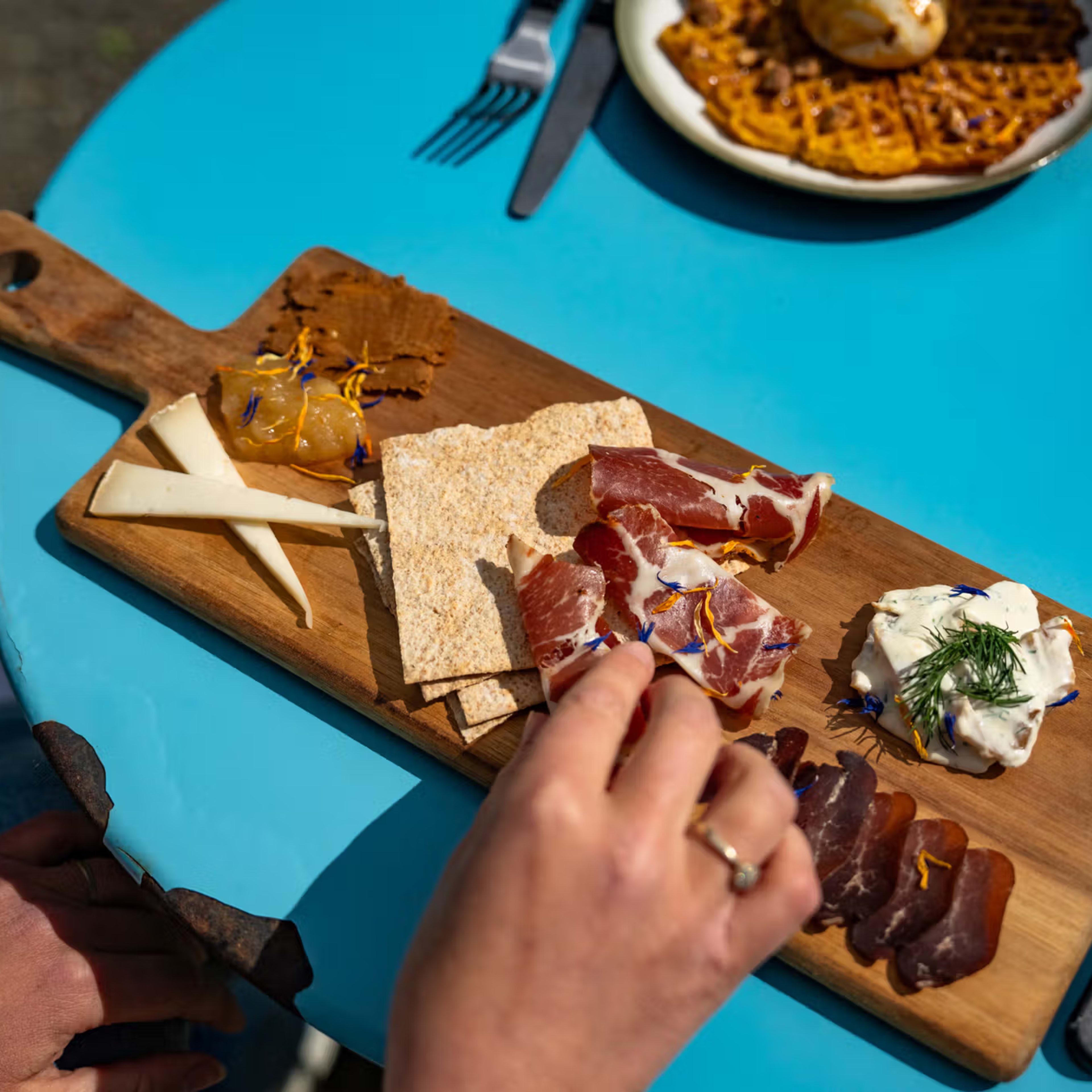 Farm tapas platter with local cheese, jam, crackers and seasonal treats at Flåm