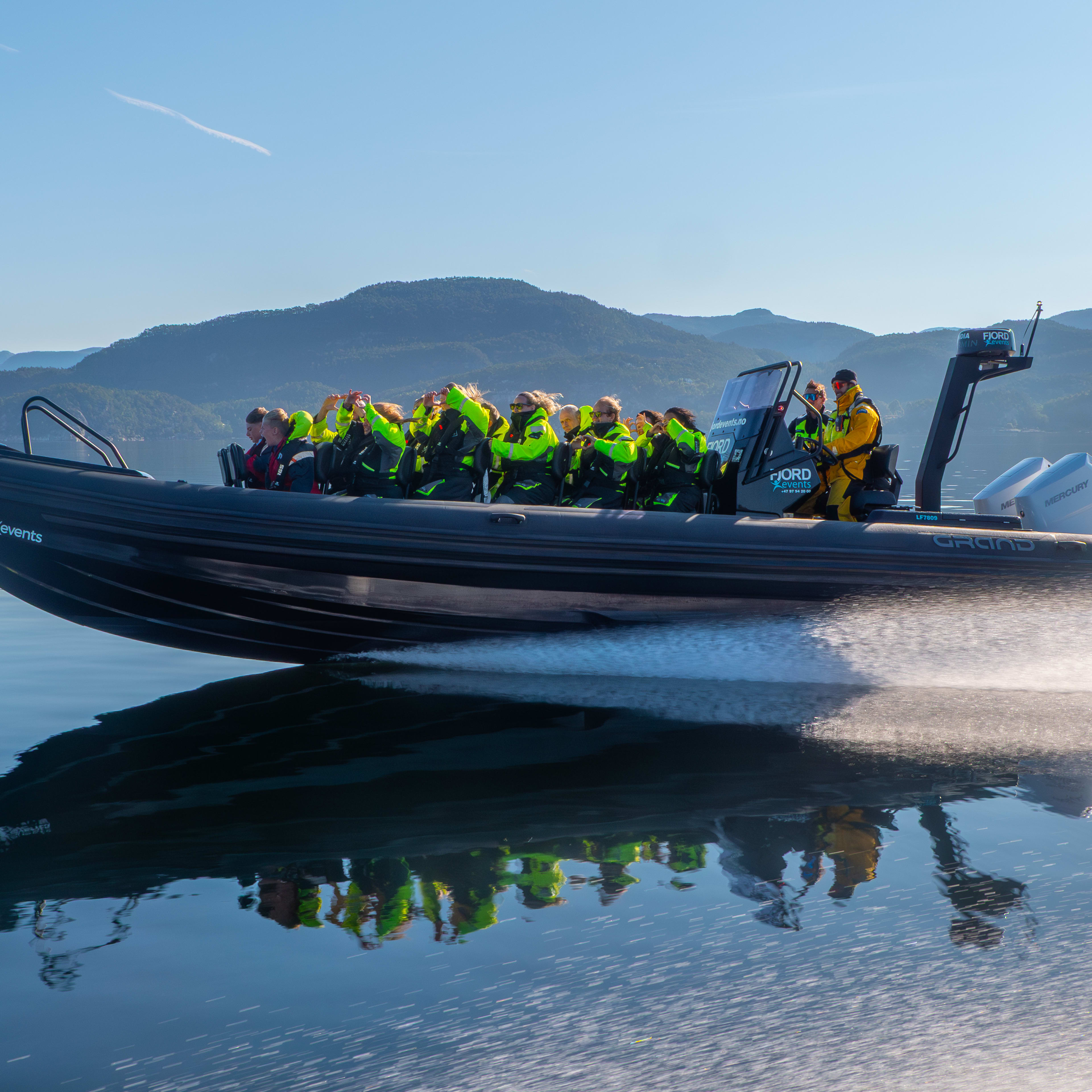 Speeding across Lysefjord by RIB boat on the way to the Flørli stairs and hike from Stavanger