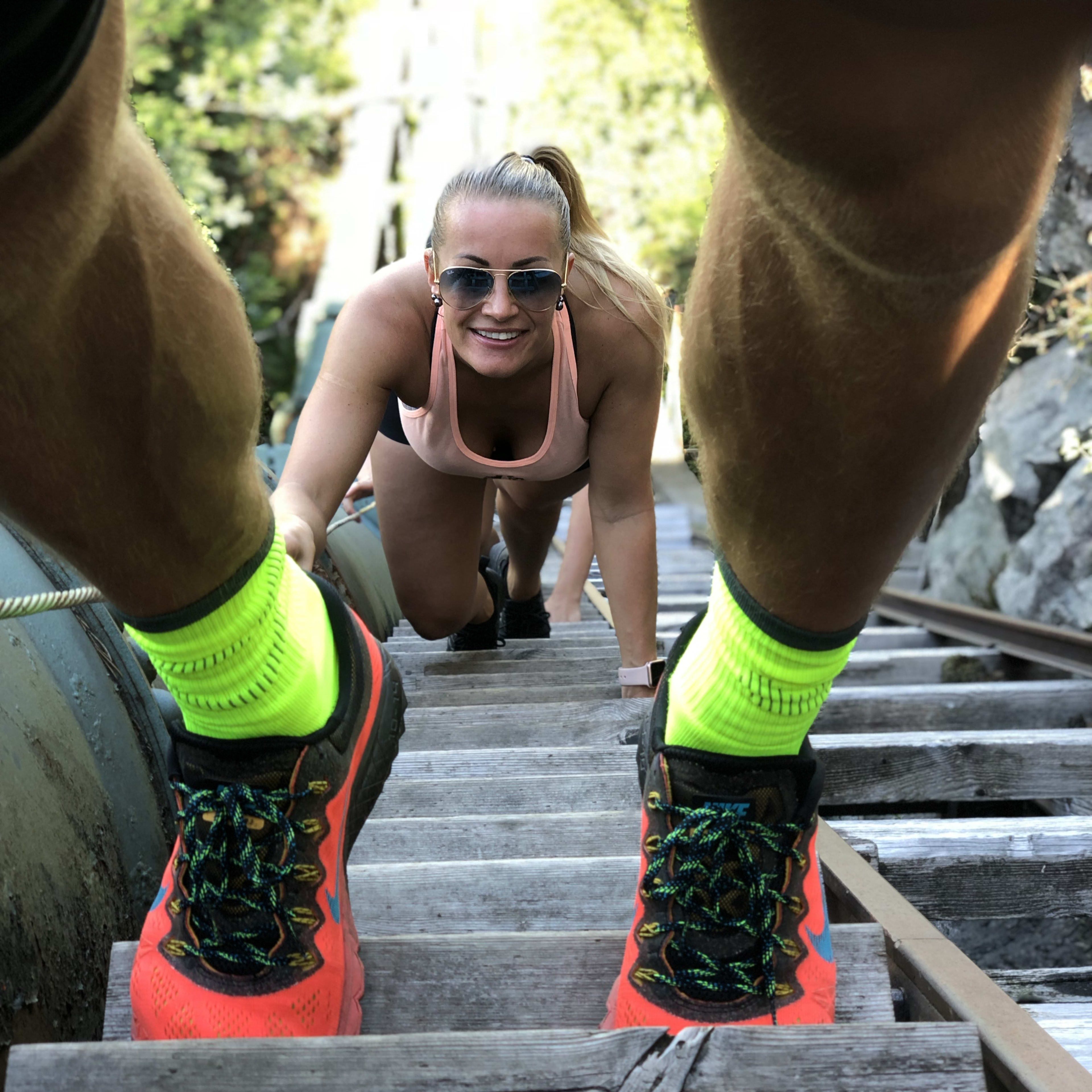 Hikers making their way up the wooden Flørli stairs on the RIB and hiking tour from Stavanger