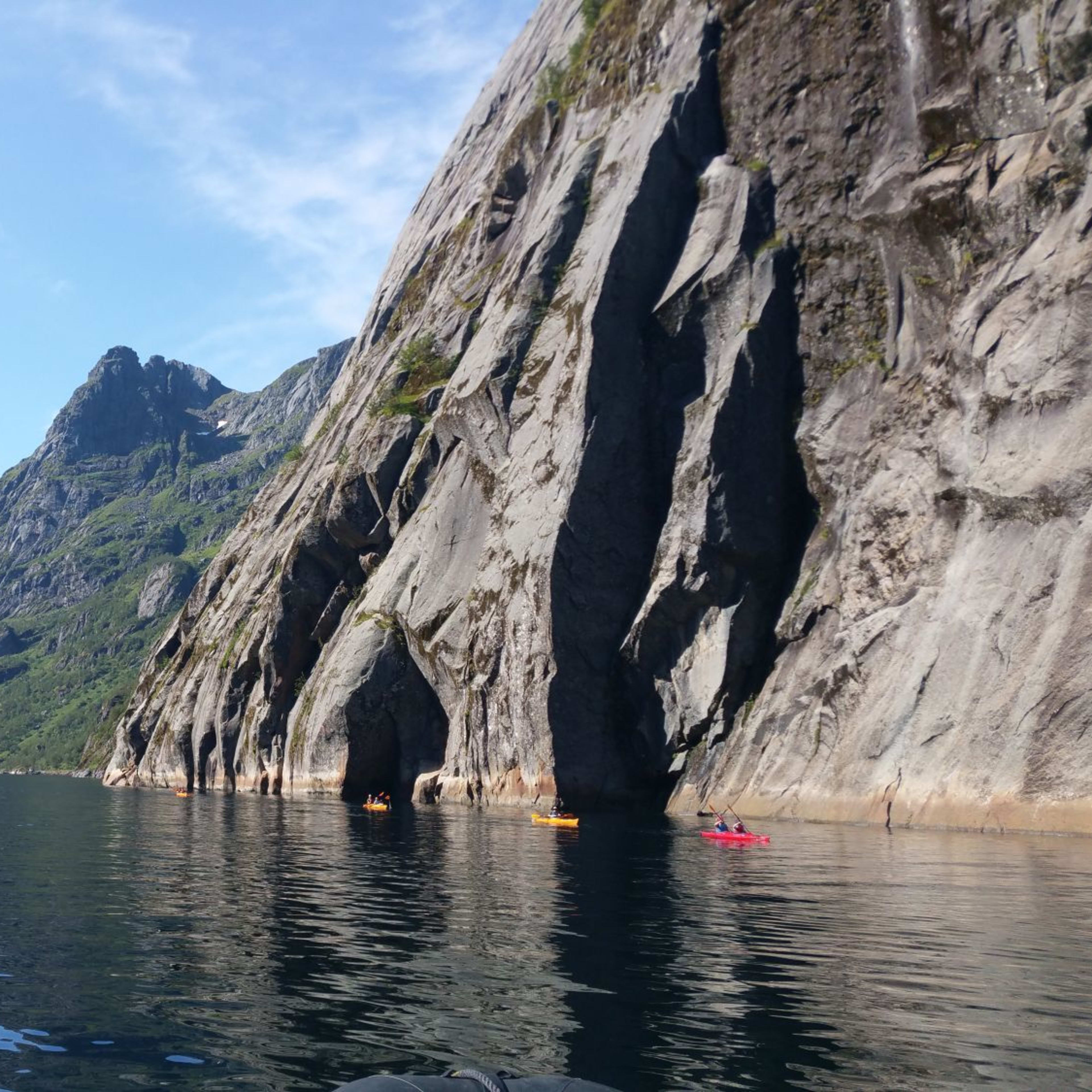 Kayaking in beautiful surroundings with crystal clear water and mighty mountains