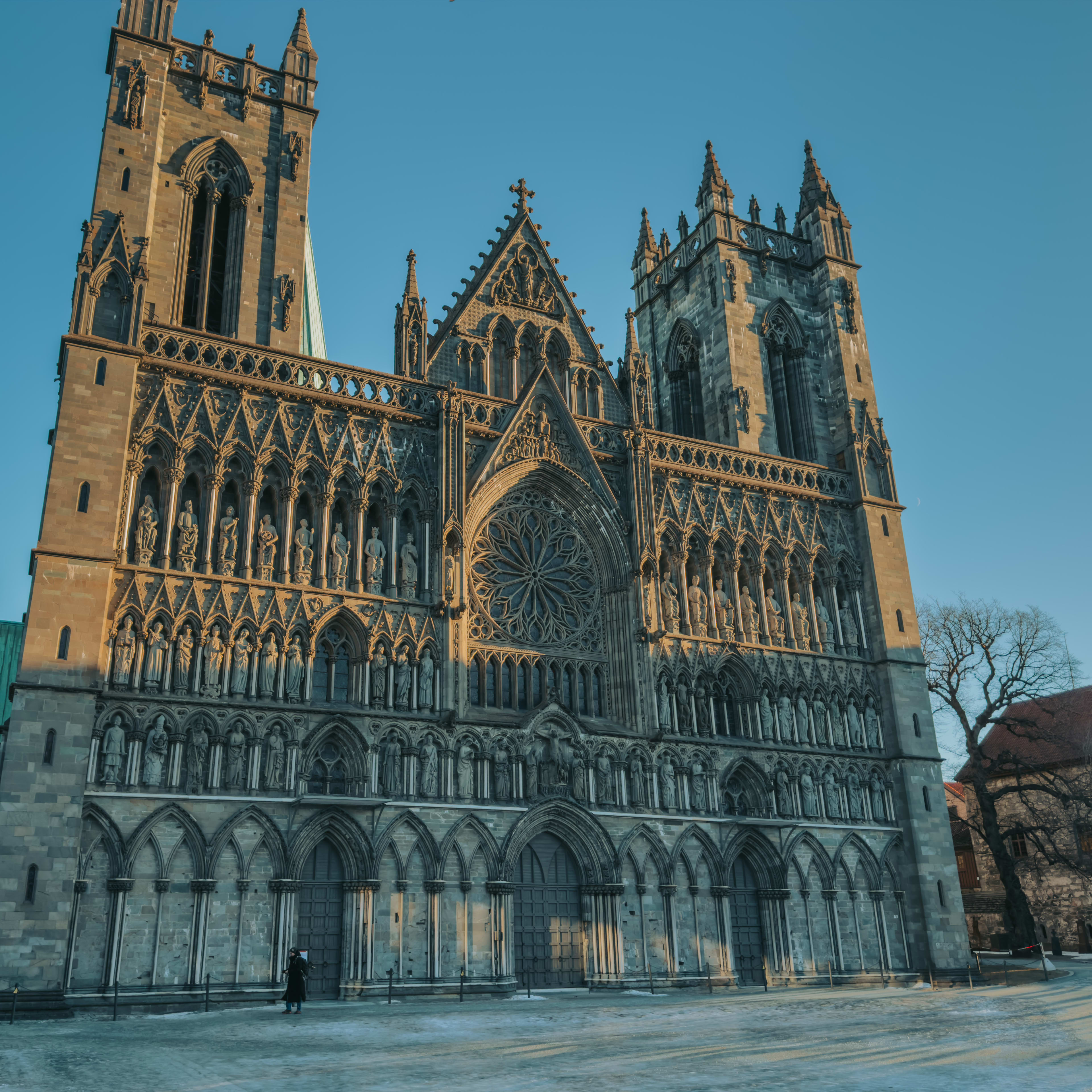 Nidarosdomen cathedral facade on a sunny day in Trondheim - Norway's national sanctuary and Gothic masterpiece in Trøndelag region