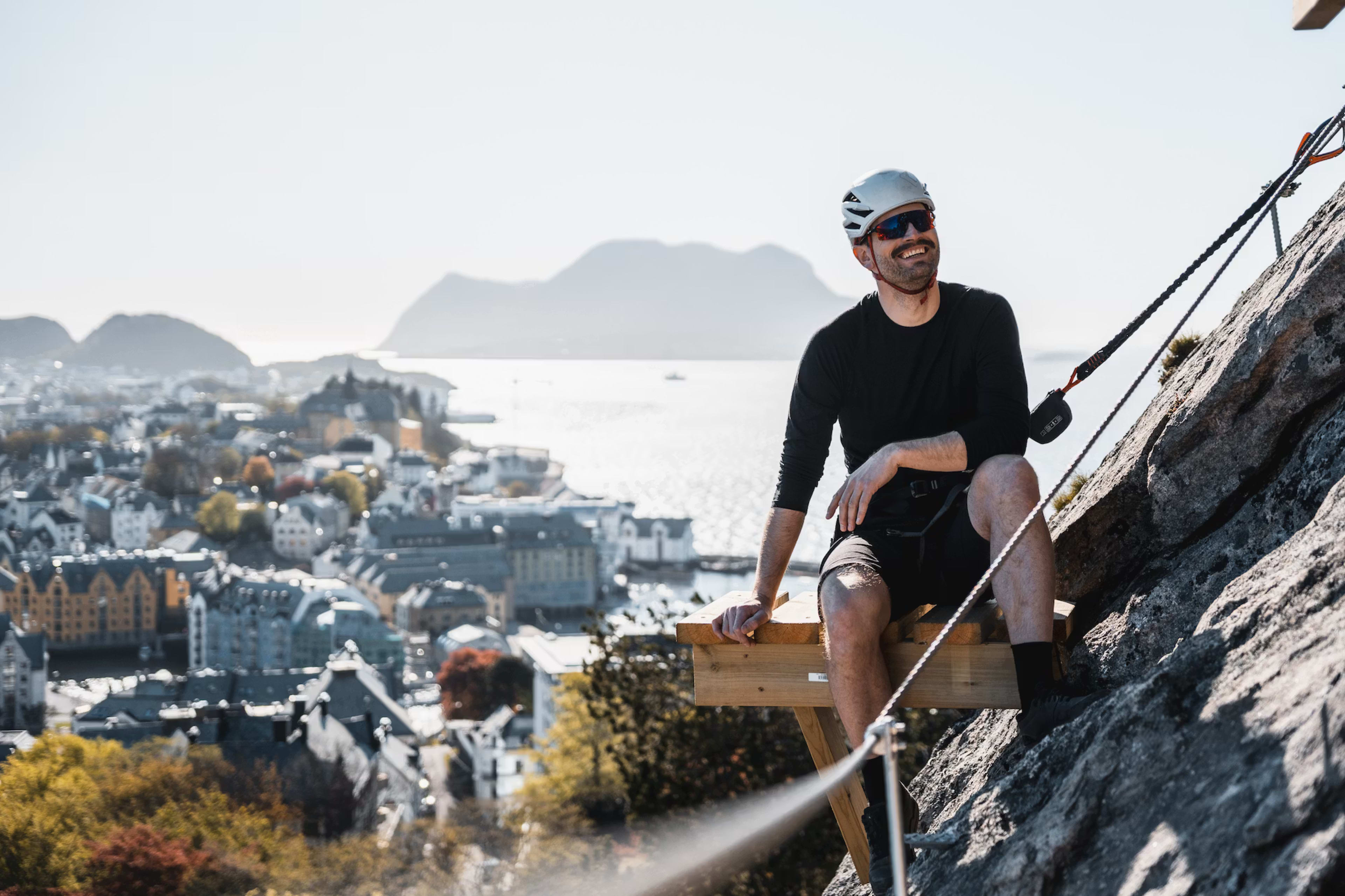 Urban via ferrata climbing with spectacular Ålesund city views in background