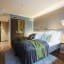 Stilvolles Twin-Zimmer im Clarion Hotel The Hub Oslo mit modernen Möbeln und Stadthotel-Komfort