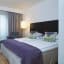Elegant double room at Thon Hotel Cecil Oslo with comfortable bed and stunning city views