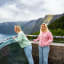 Tourists enjoying spectacular views at Stegastein viewpoint overlooking Aurlandsfjord