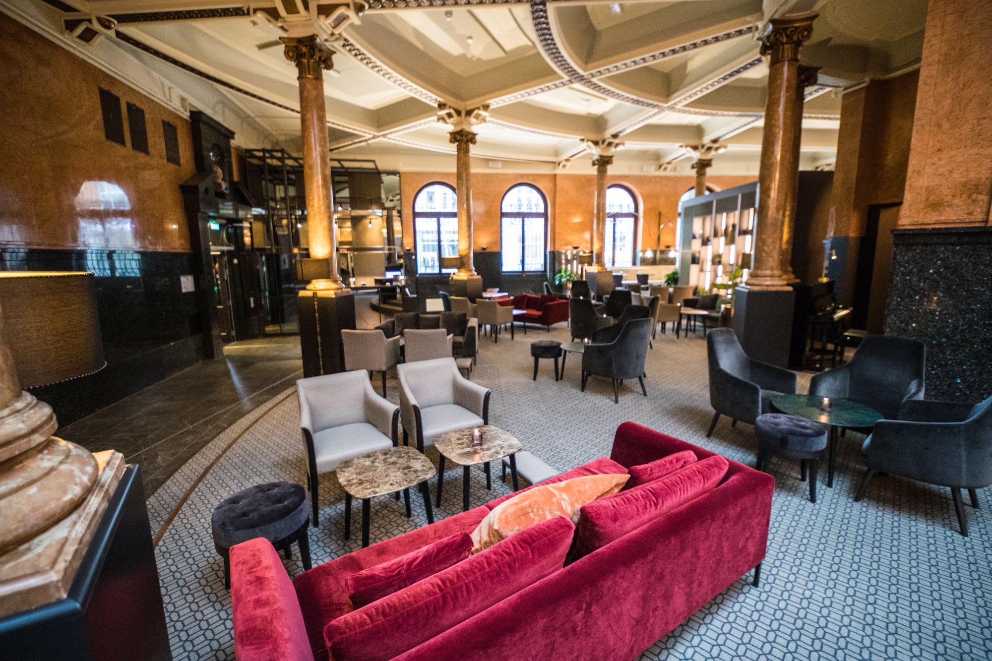 Comfortable lounge area with vibrant furniture at centrally located Opus XVI Hotel in Bergen Norway