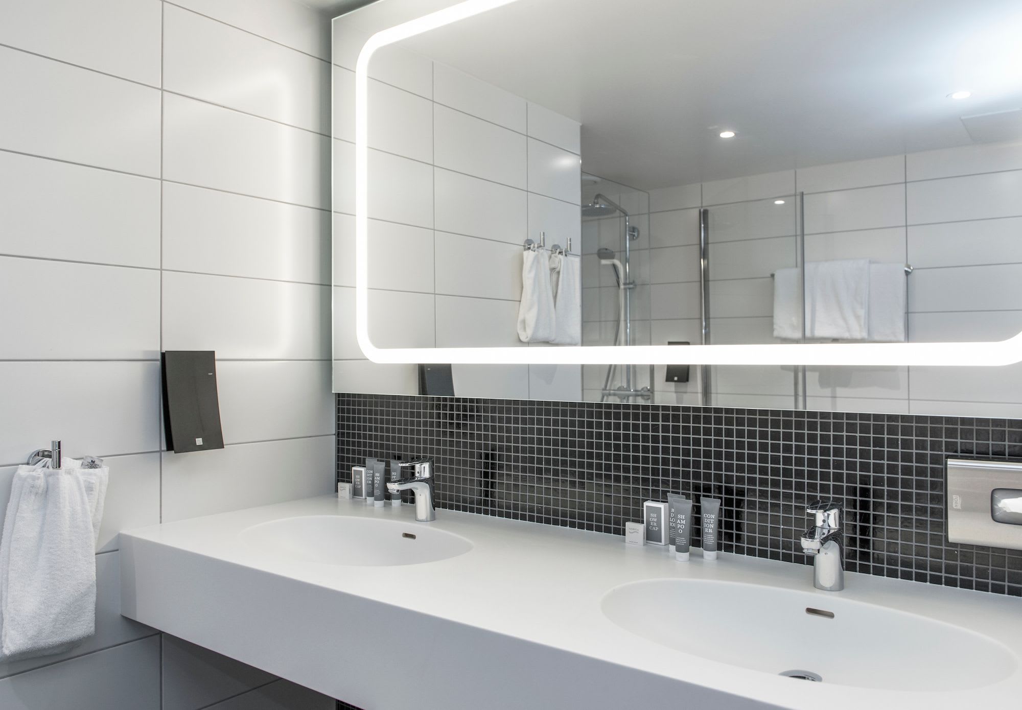 Modern bathroom Thon Hotel Orion Bergen with double washbasins and stylish interior design