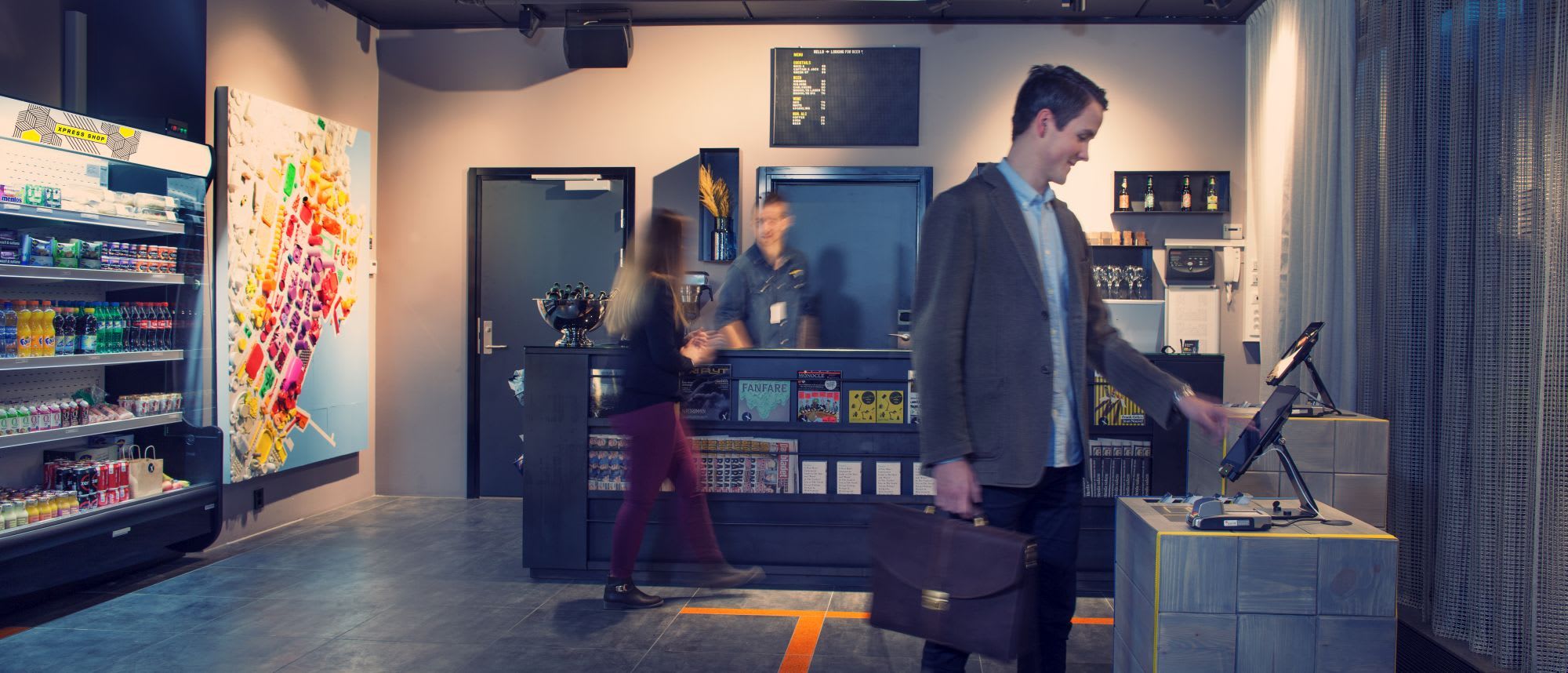 Comfort Hotel Xpress reception desk Tromsø featuring automated check-in and coffee
