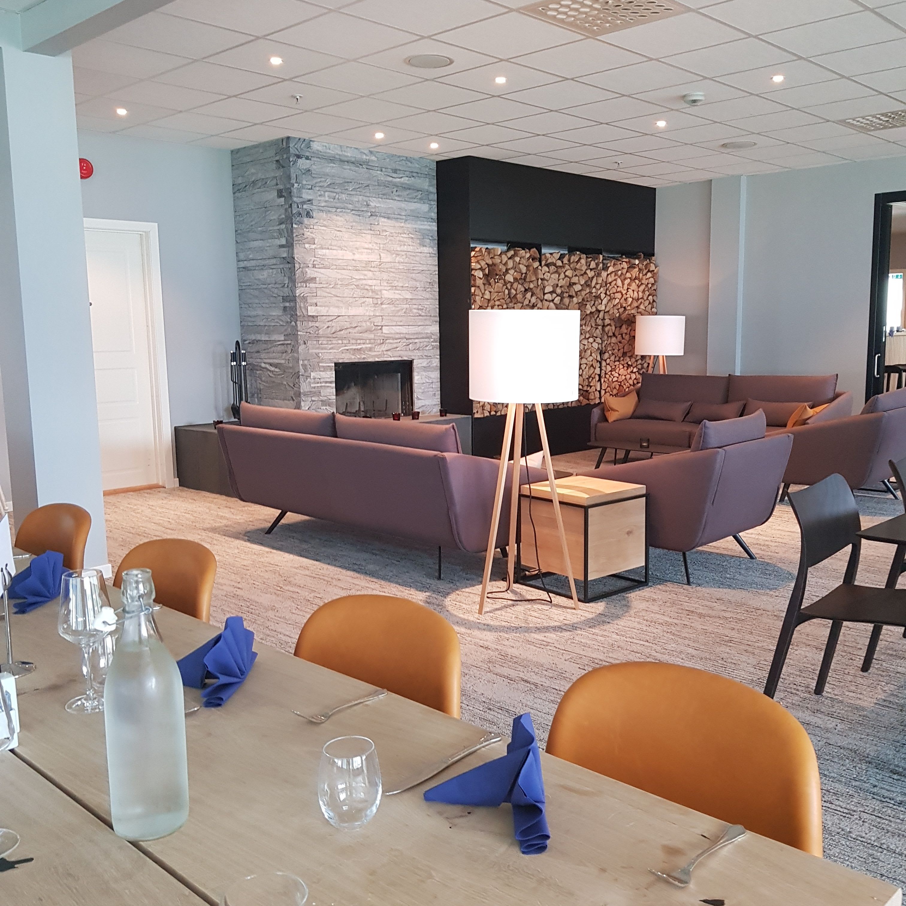 Modern hotel lounge at Vøringfoss Hotel Eidfjord with fireplace and contemporary design furniture