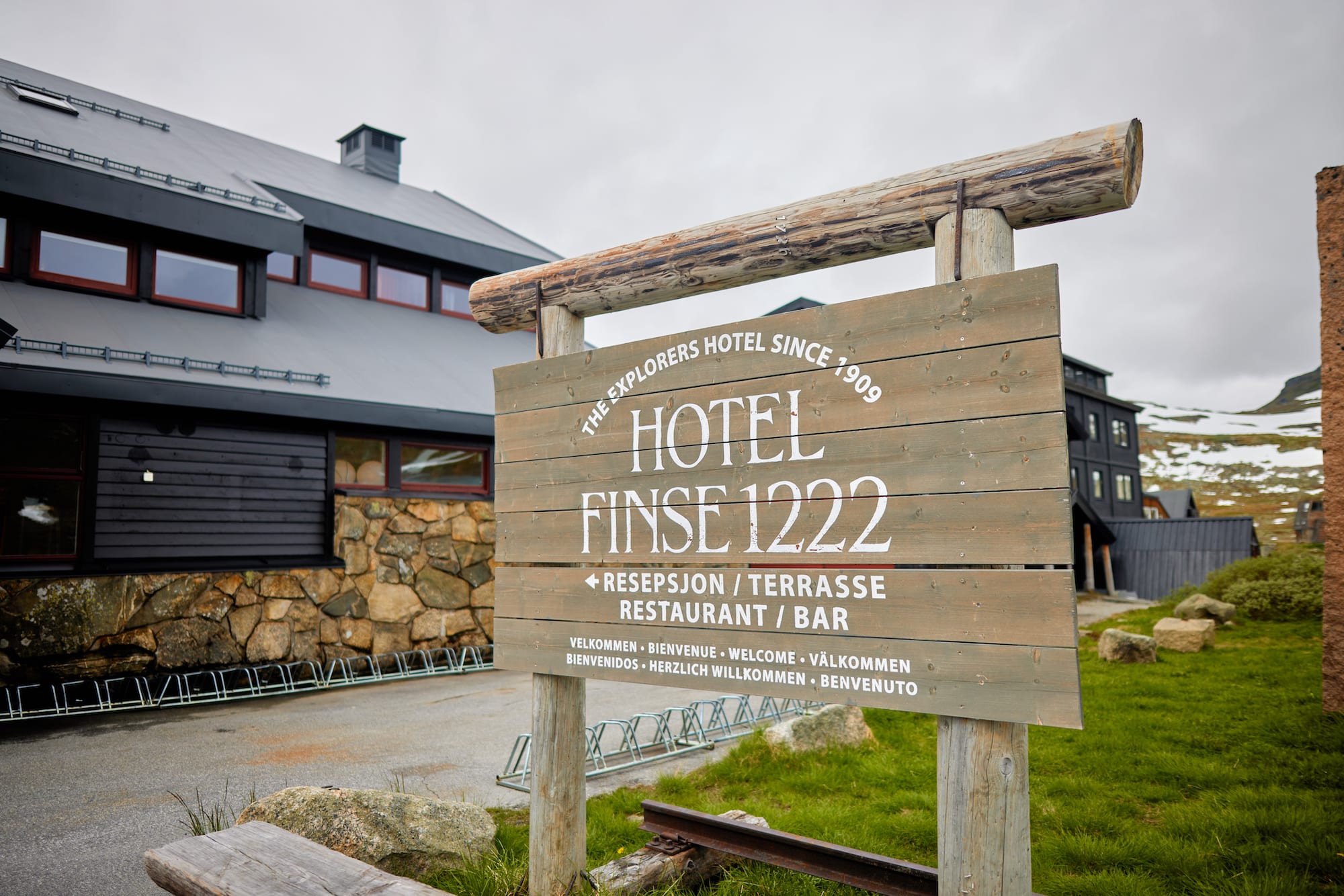 Classic wooden hotel sign at Hotel Finse 1222 entrance near Bergen Railway station with glacier views