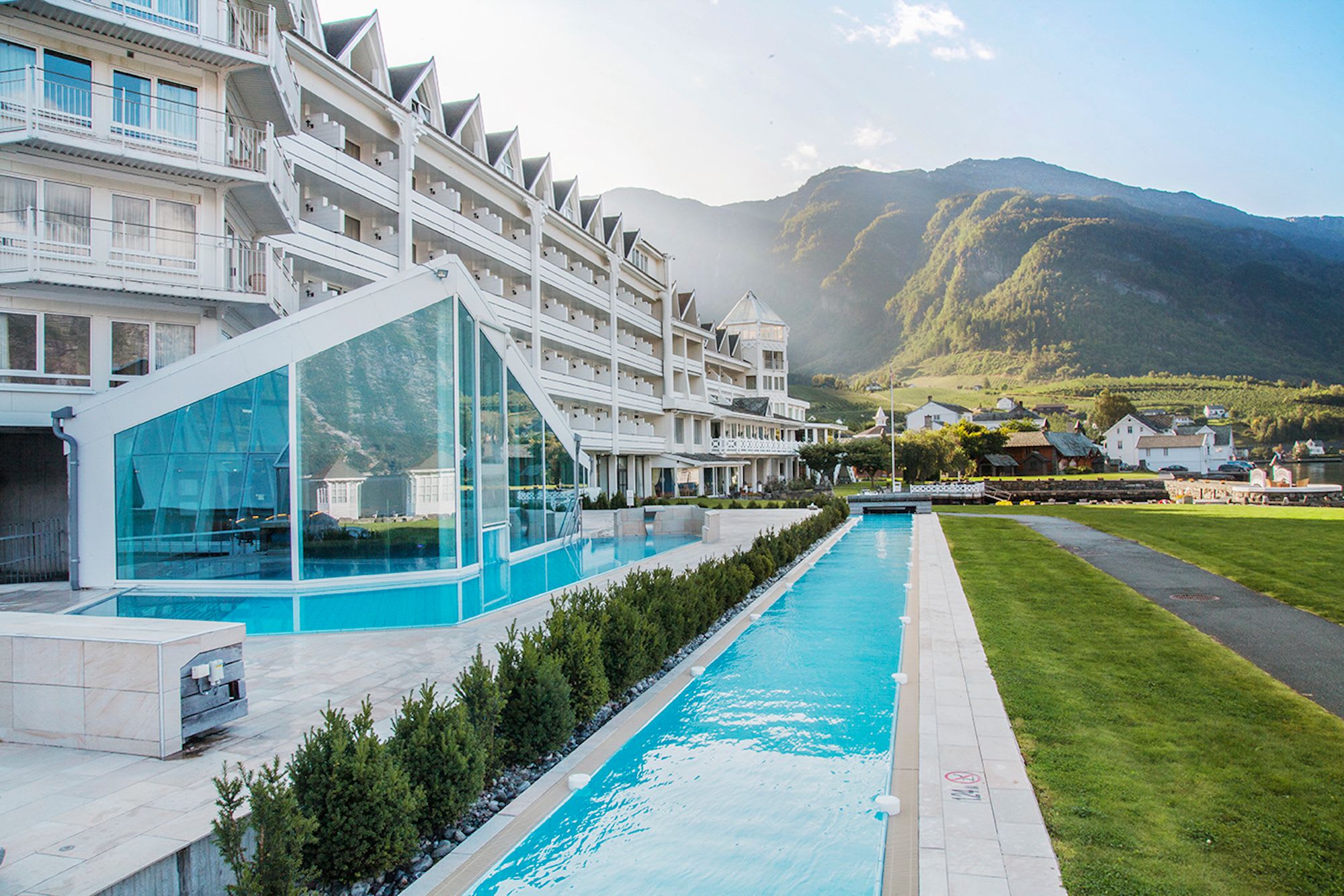 Outdoor pools at Hotel Ullensvang Lofthus with spectacular Hardangerfjord views and mountain surroundings