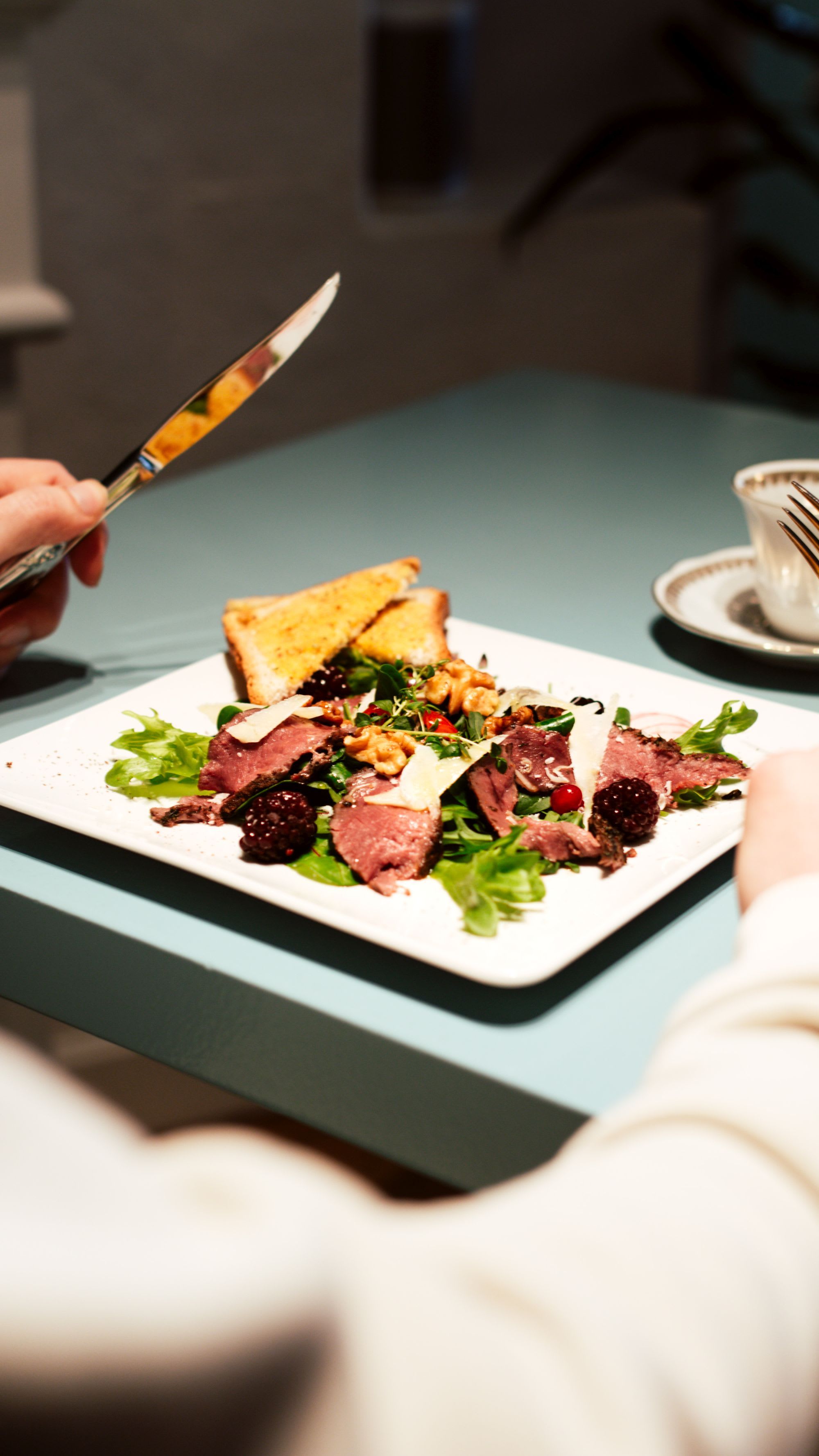 Fresh salad served at Trolltunga Hotel restaurant in Odda with scenic Norwegian fjord views