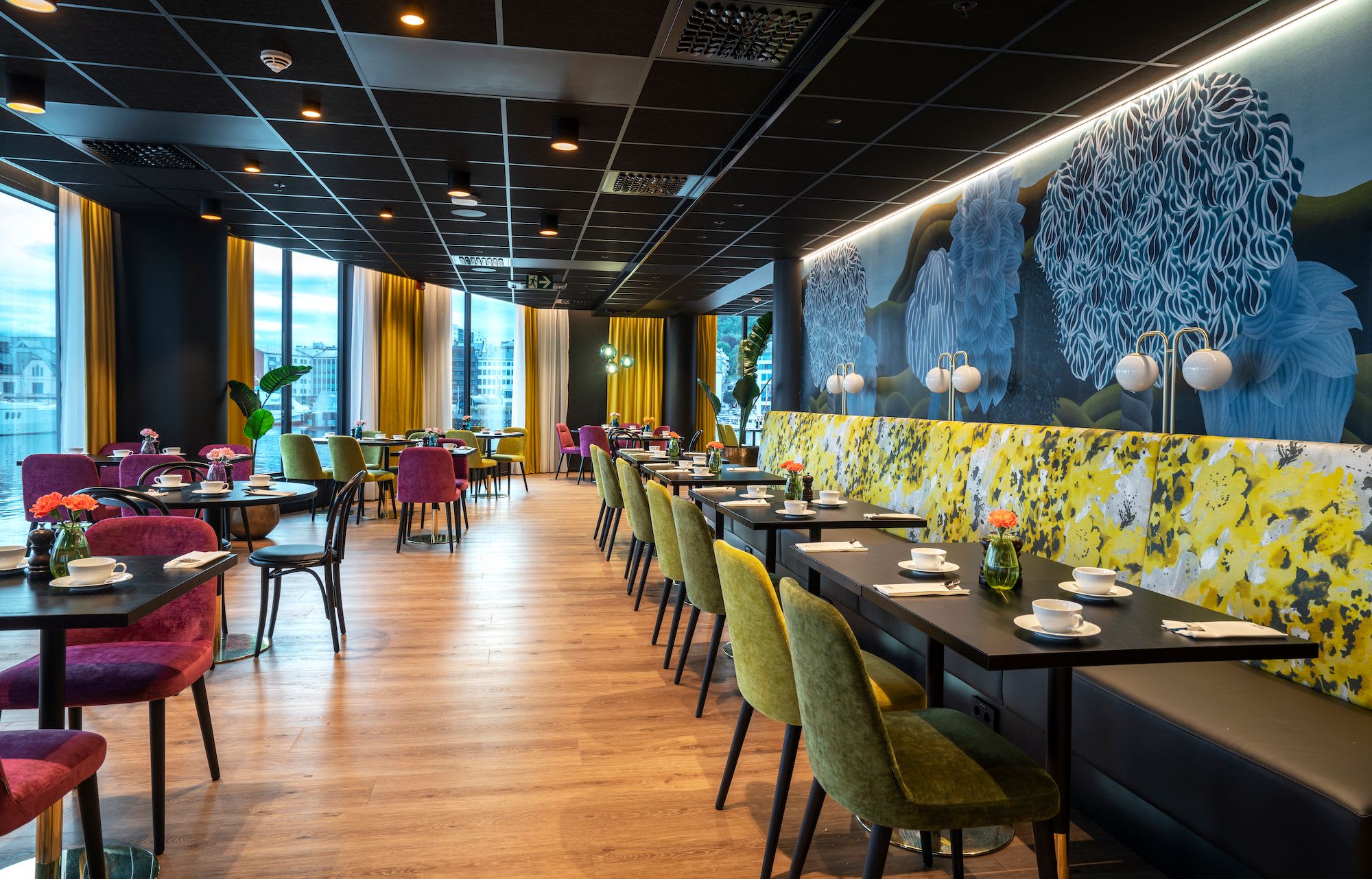 Stylish breakfast dining area at Thon Hotel Ålesund featuring bright chairs and modern decor