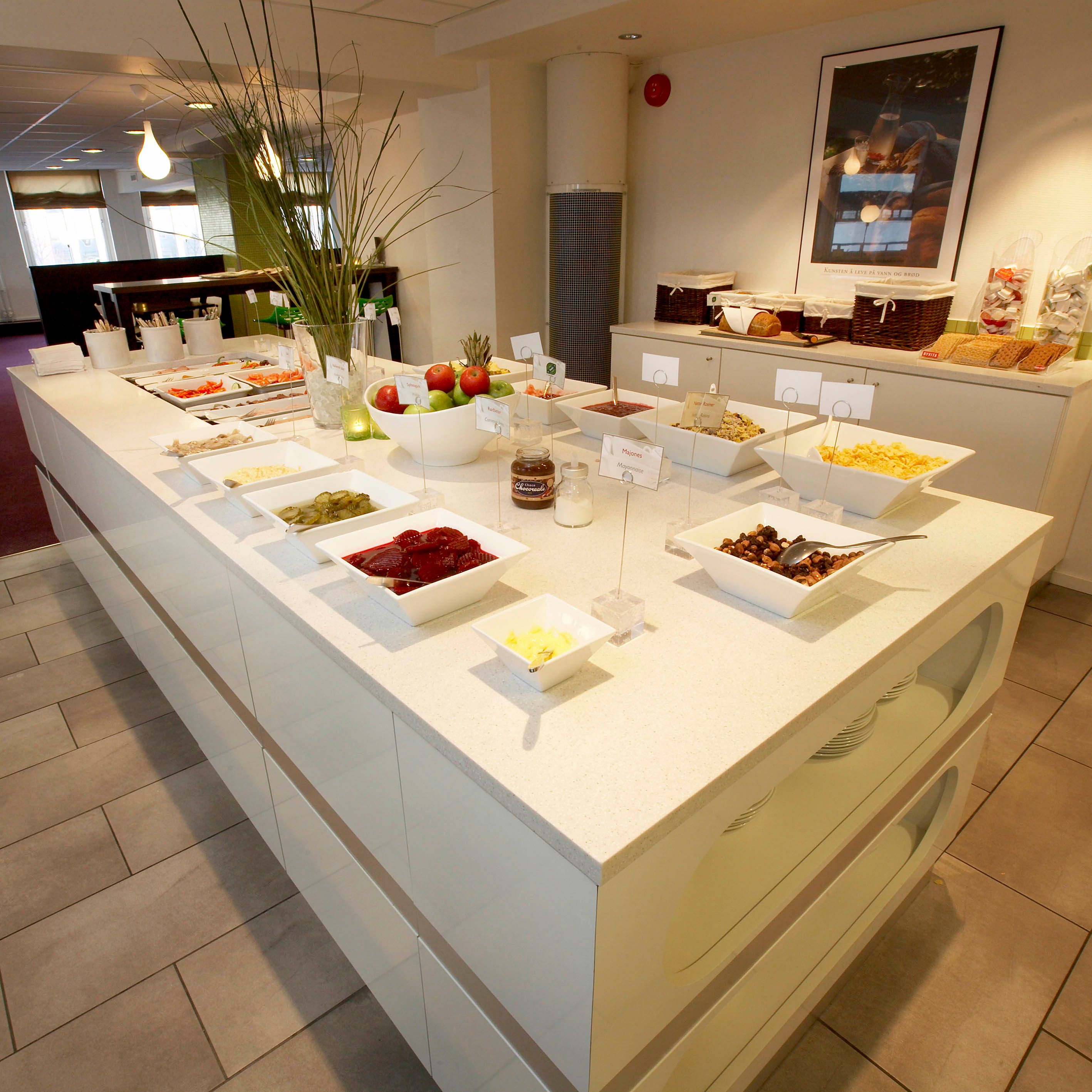 Thon Hotel Trondheim breakfast buffet with hot dishes, pastries, bread and fresh fruit