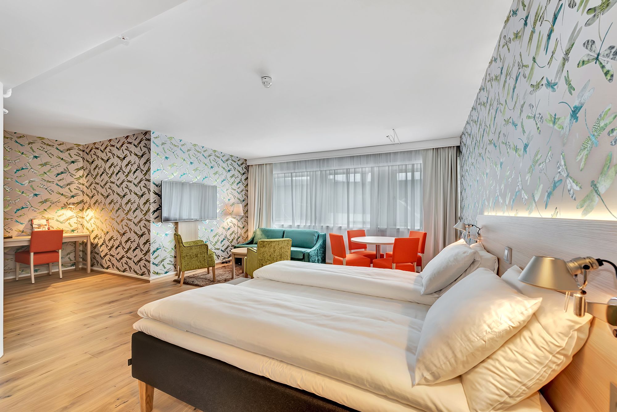 Premium accommodation in Tromsø featuring modern design, king-size bed, and Arctic city panorama