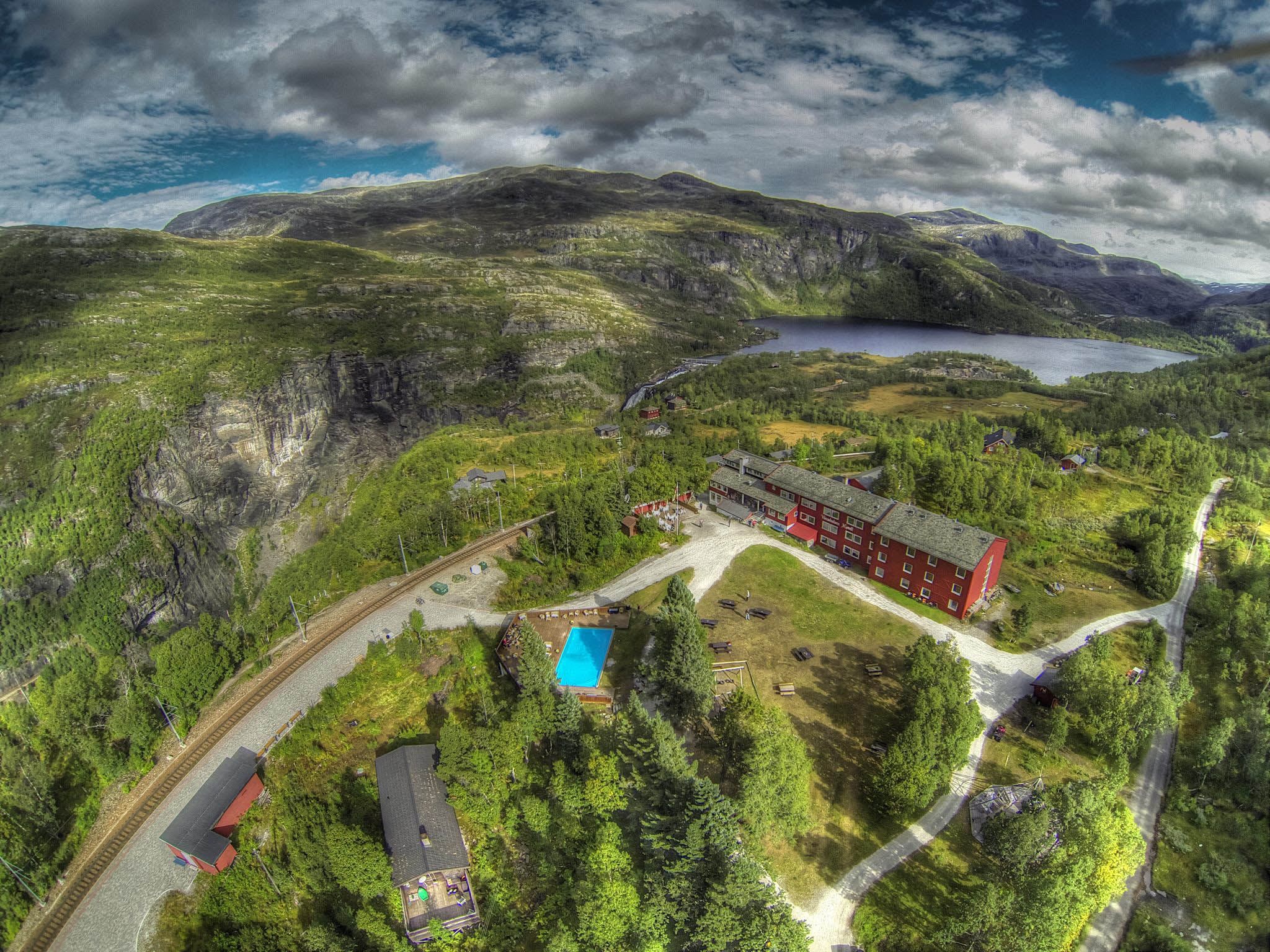 Vatnahalsen Høyfjellshotel aerial view - mountain hotel with outdoor pool in Norwegian wilderness