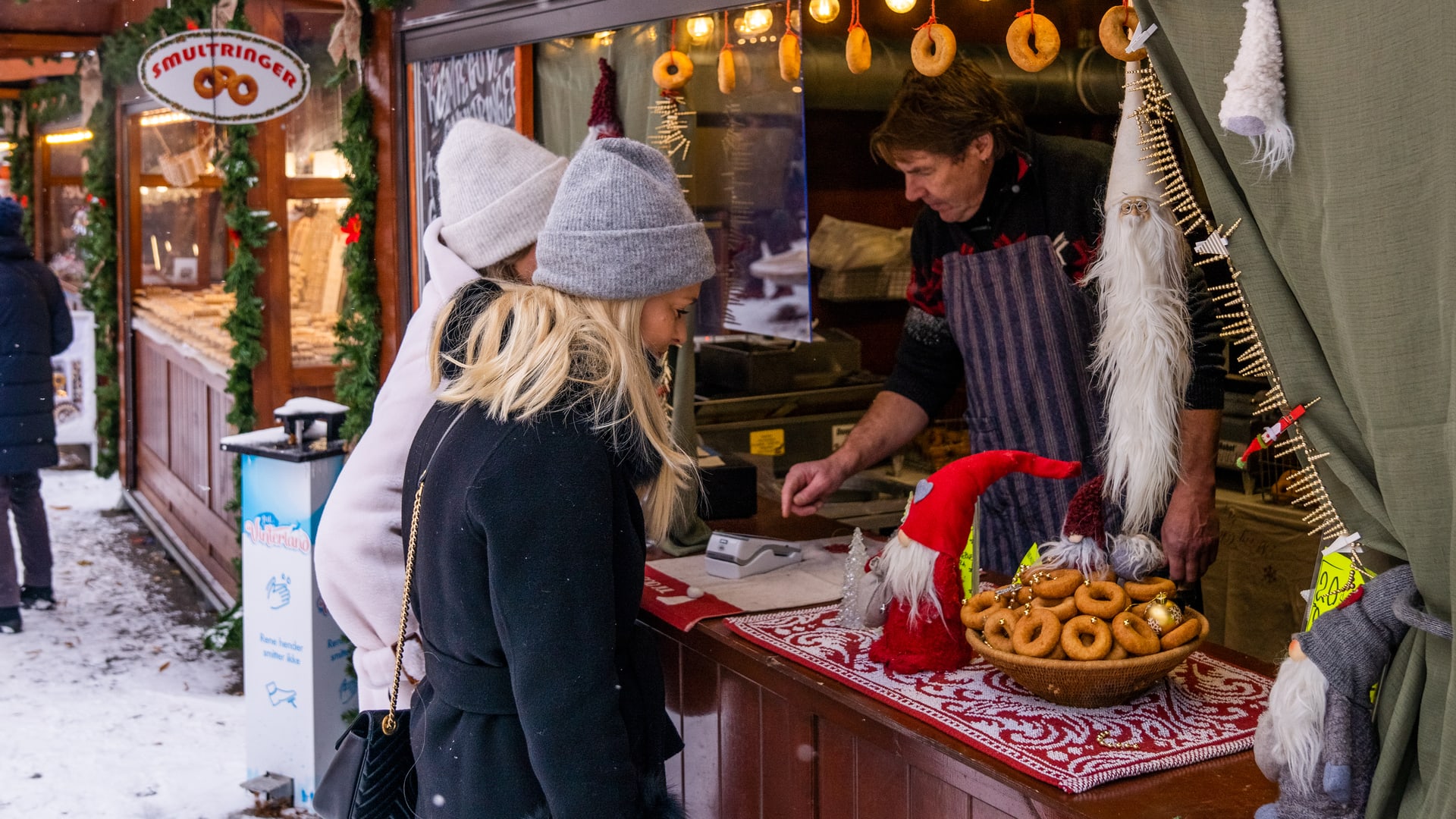 Traditional Norwegian Christmas market with food stalls serving authentic Norwegian cuisine and holiday treats
