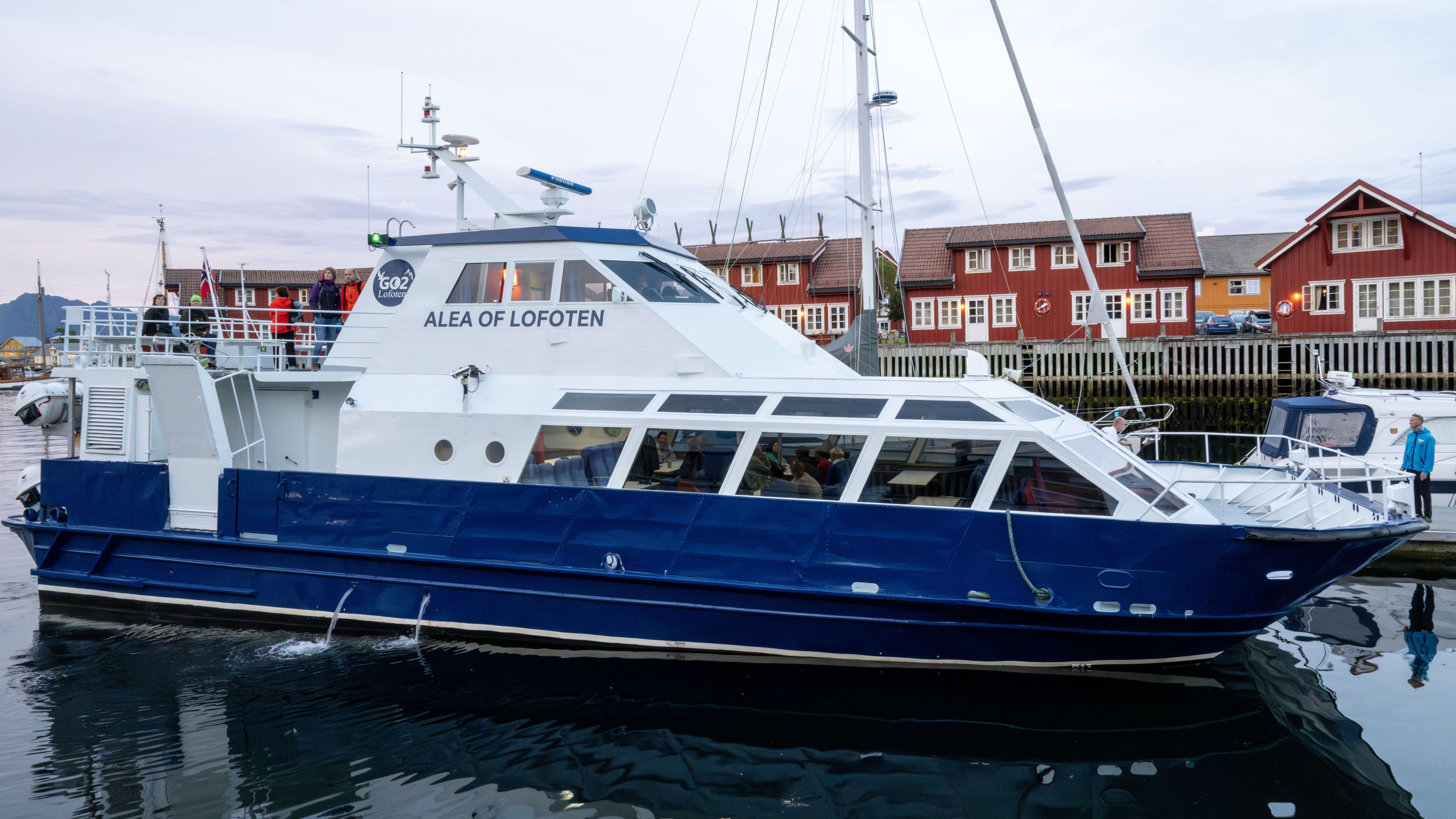 Boat ready for departure from Svolvær harbor in Lofoten for Trollfjord cruise and sea eagle watching tour
