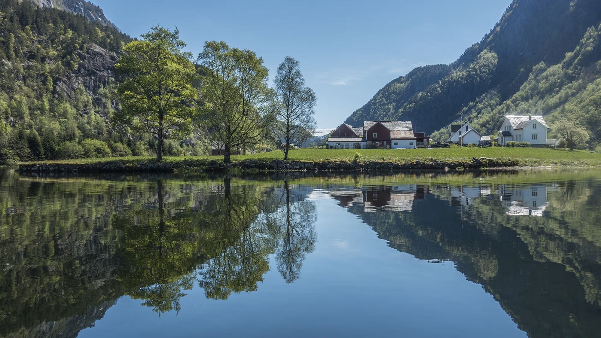 Traditional houses in cultural landscape surrounding Sandvinsvatnet Lake
