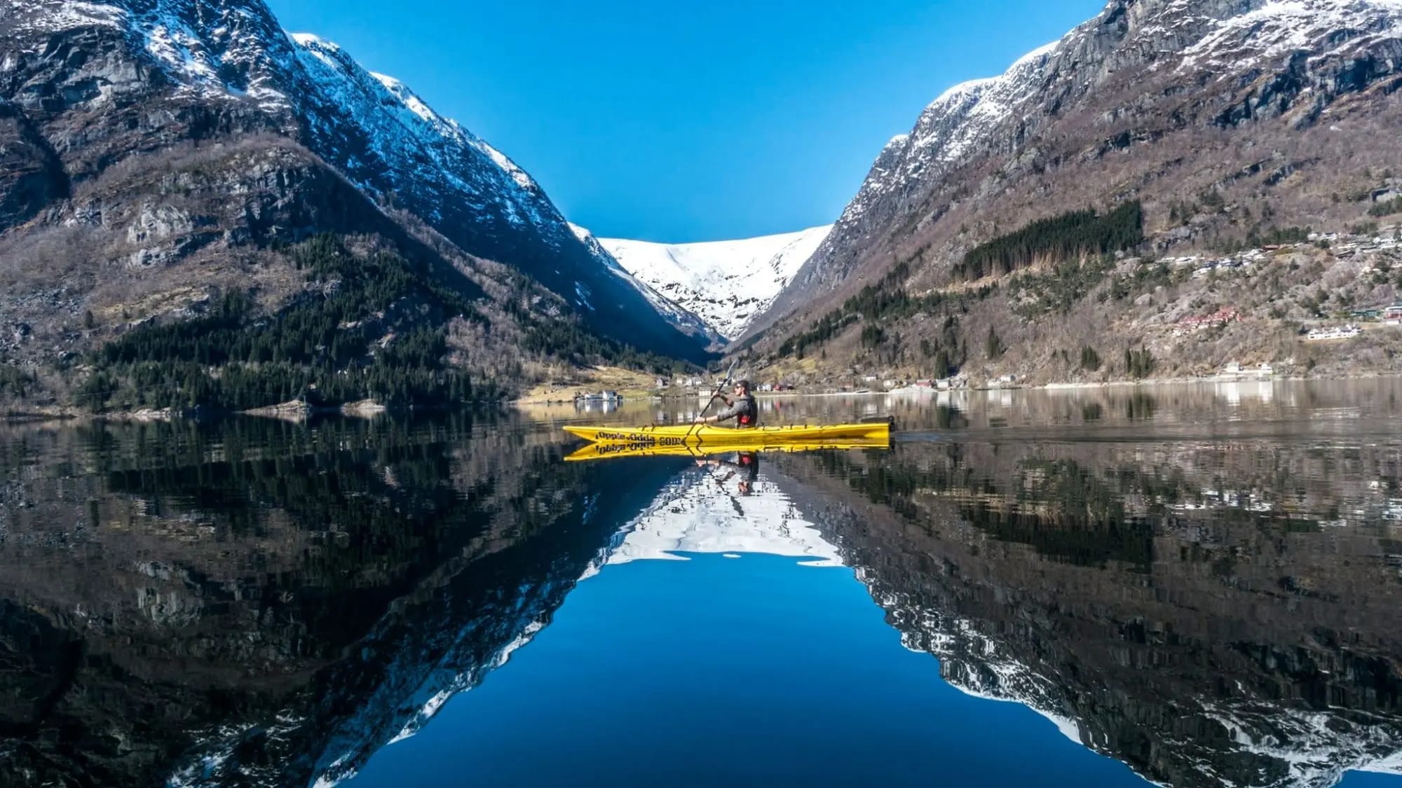 Perfect mountain reflections in calm Sandvinsvatnet Lake waters