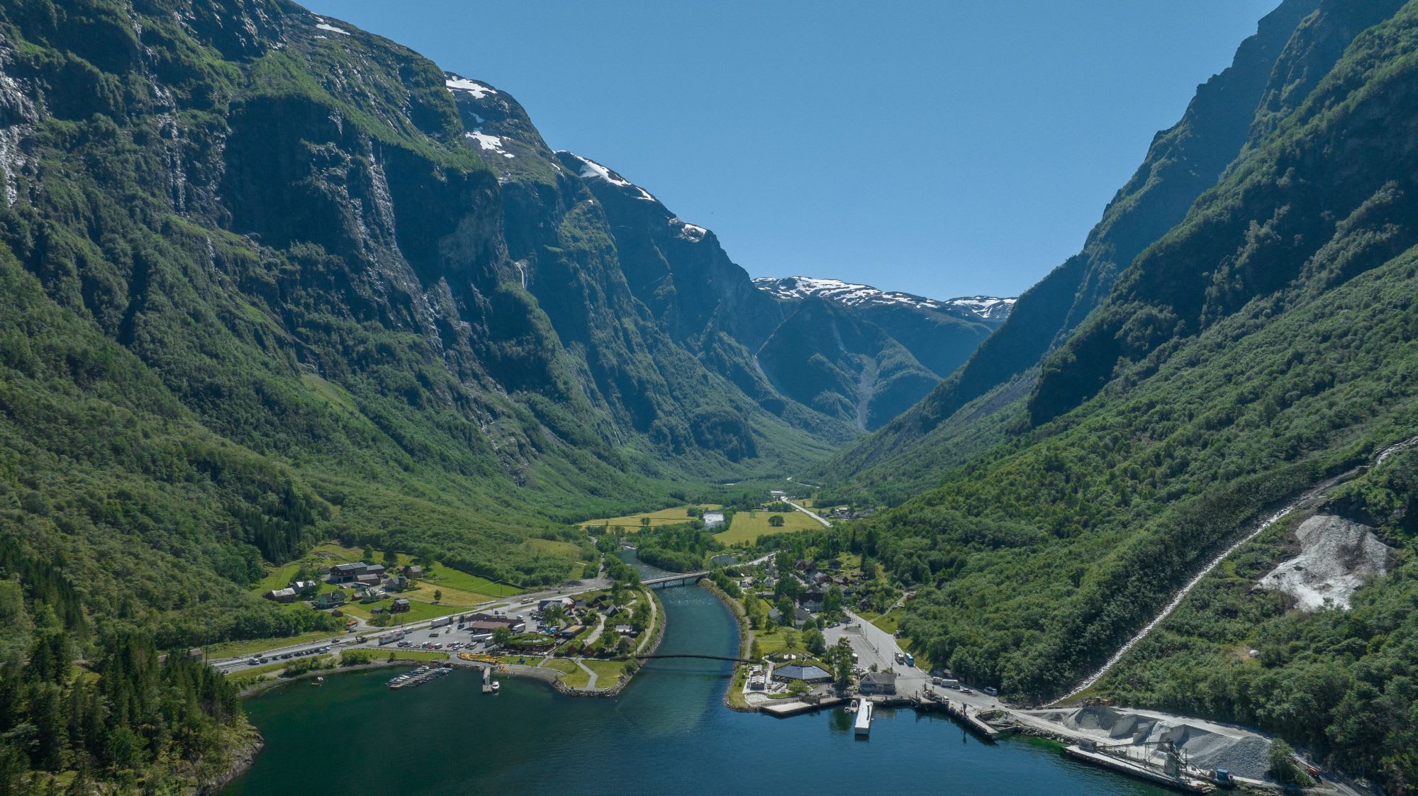 Aerial view of fjord valley, village, river and harbor.