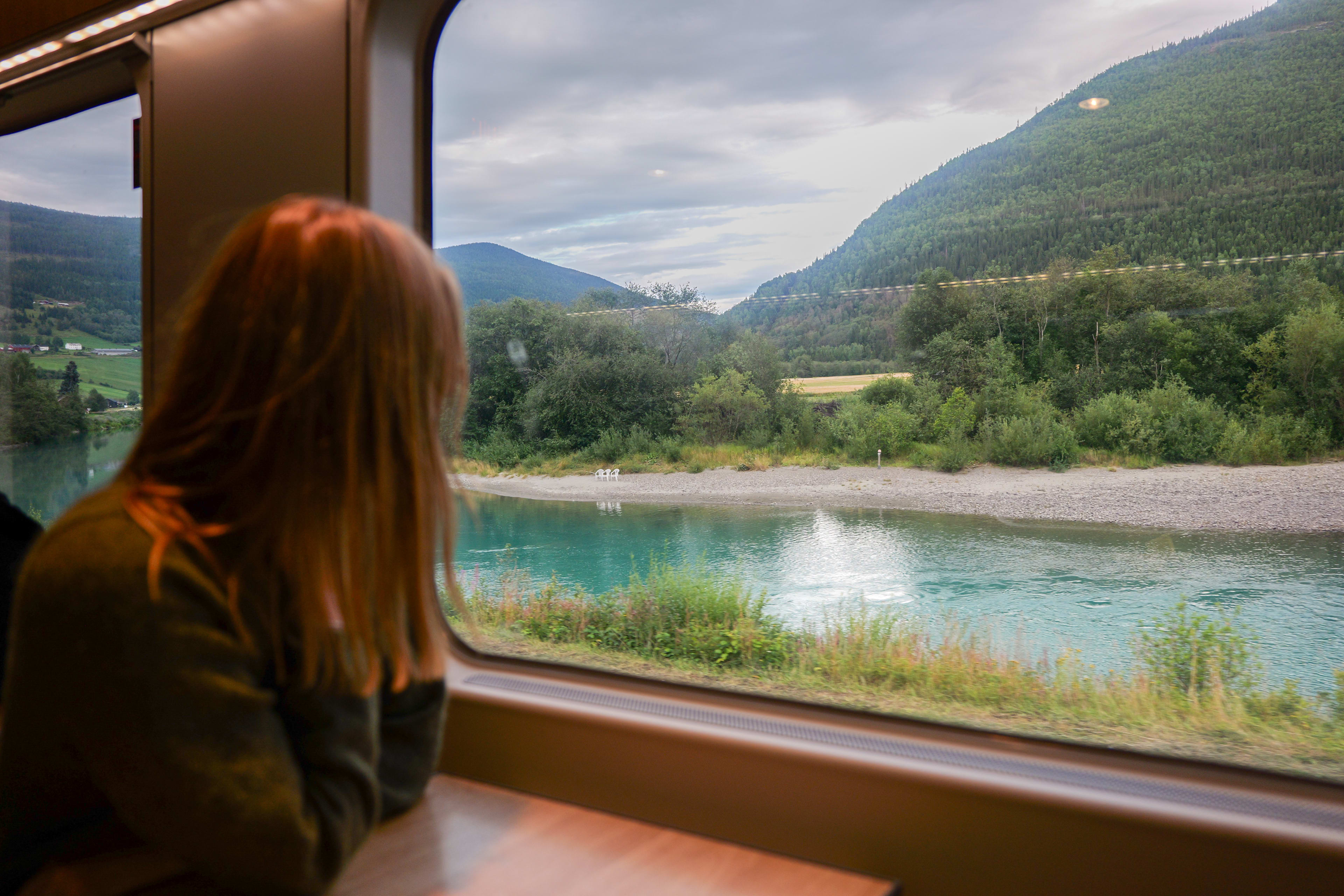 Woman looking out of the train window on the Dovre Railway