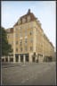 Savoy 1918 hotel facade in Oslo – beige brick building on a quiet city street.