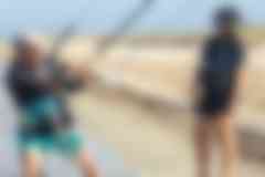Kitesurf instructor explaining kite control