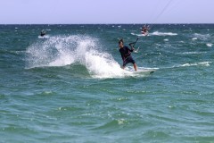 Buji kitesurfing with a strapless board
