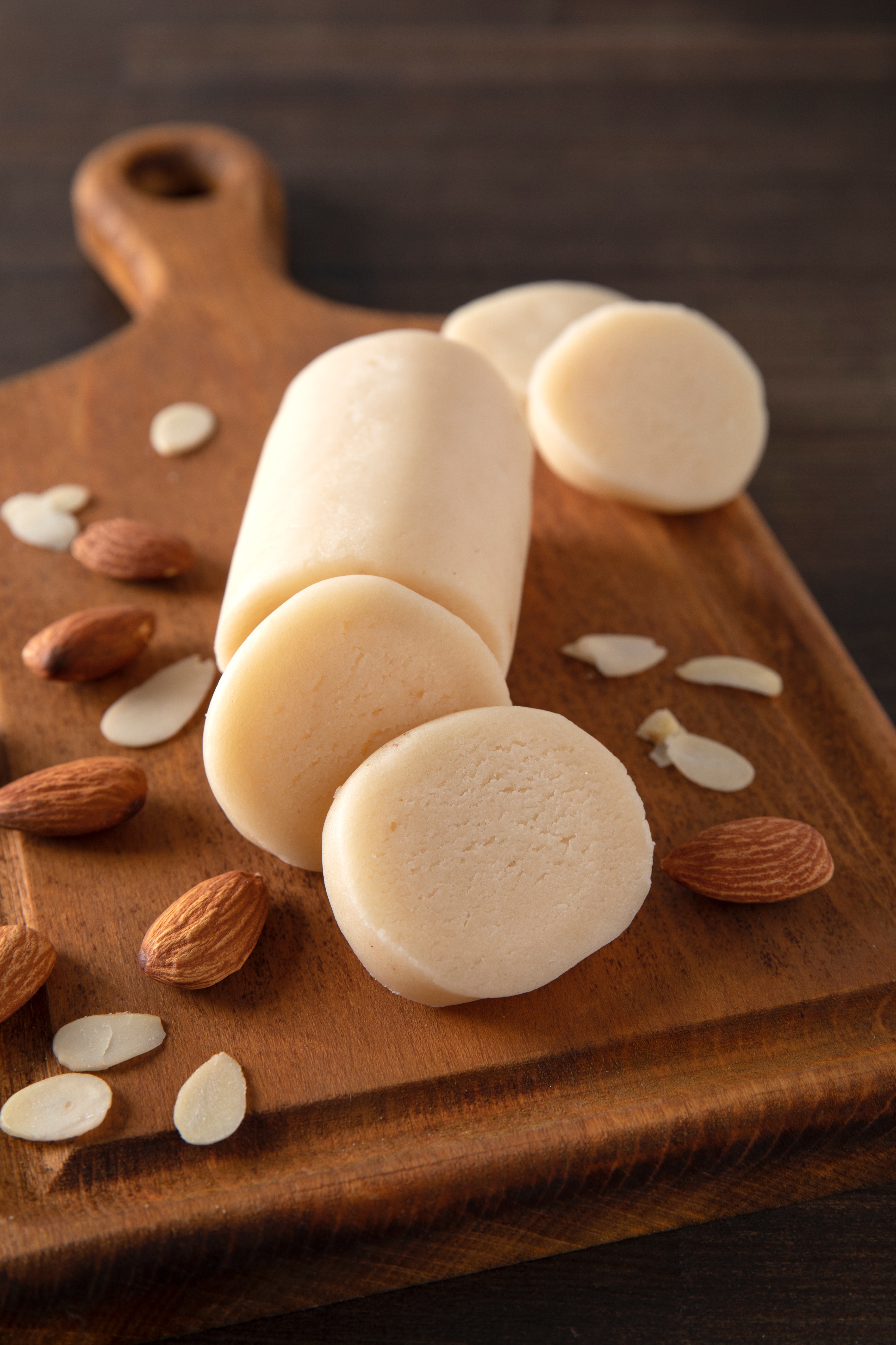 Ball of homemade marzipan with almonds