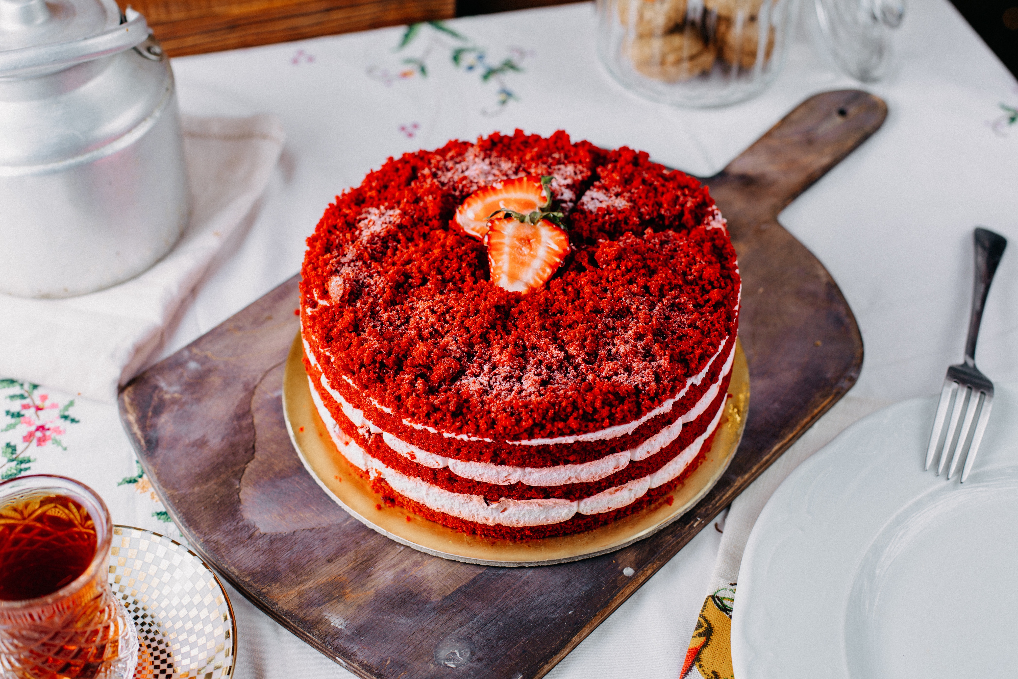 Slice of red velvet cake with cream cheese frosting