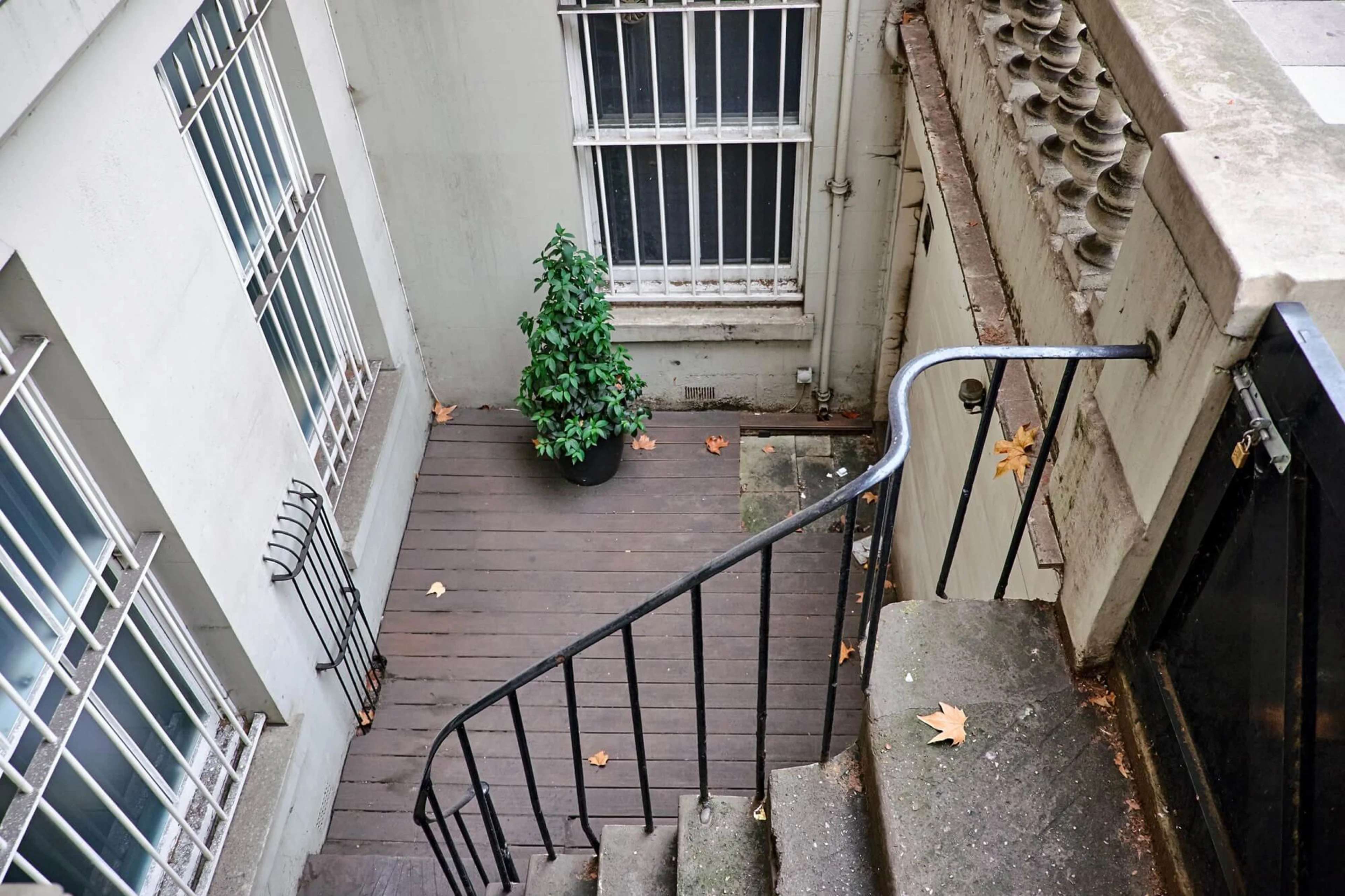 A staircase that leads onto the front door of a basement flat in London.
