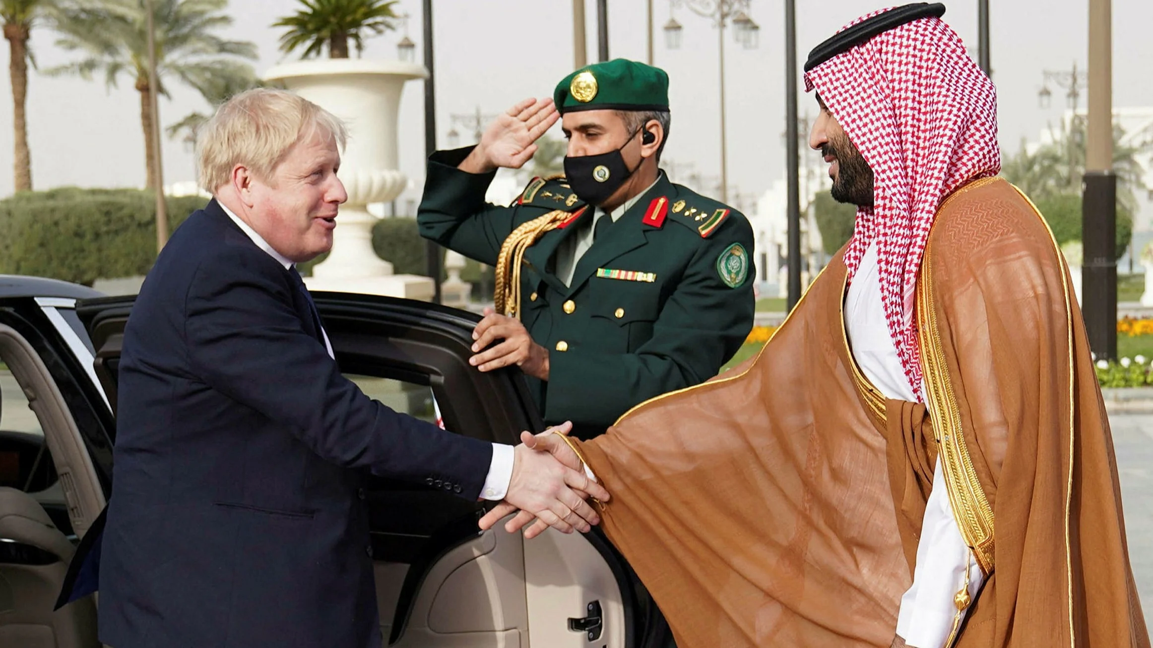 Boris Johnson shaking the hand of Saudi ruler Crown Prince Mohammed bin Salman