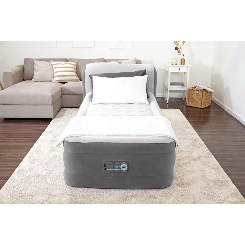 Inflatable bed with online headboard