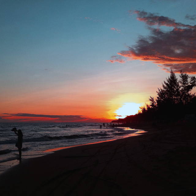 "Red sun setting" stock image