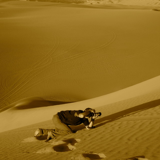 "Photographer on sand dunes" stock image