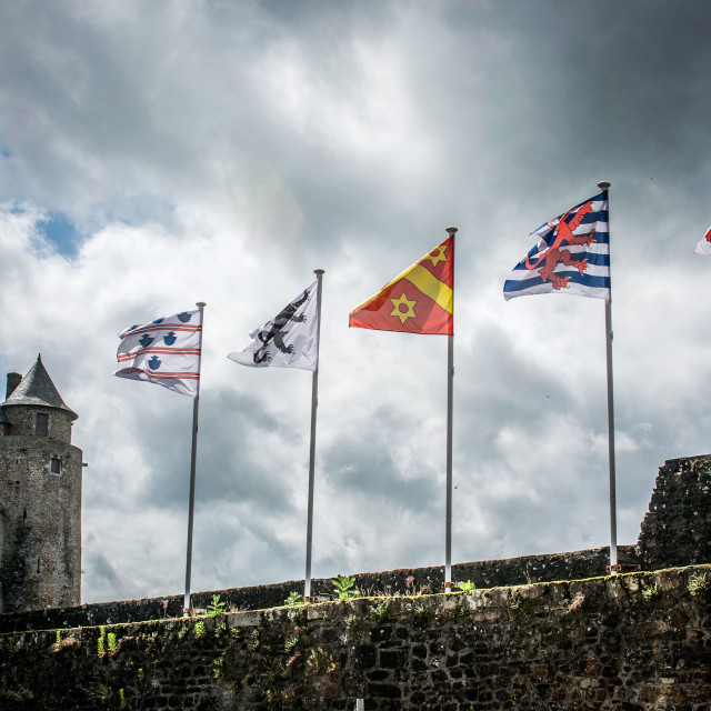 "Flags Fluttering Chateau de Fougeres" stock image