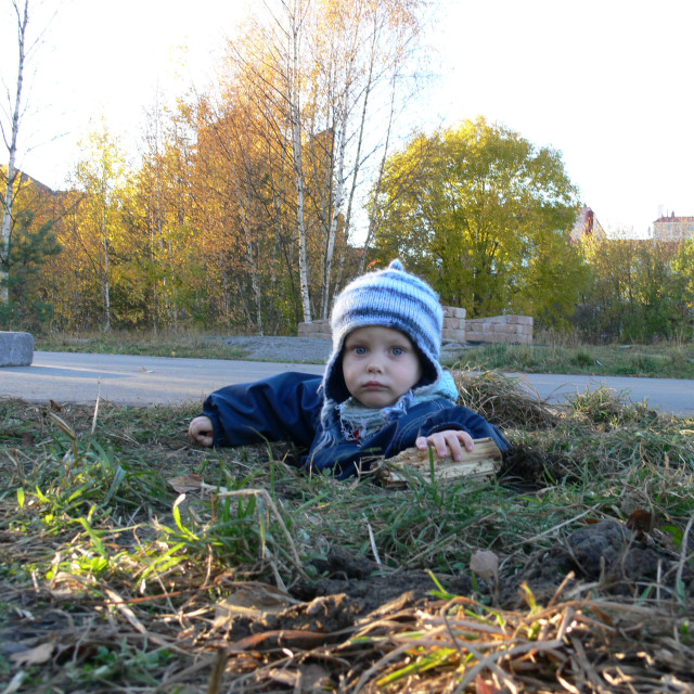 "Spontanous child in a hole, of course." stock image