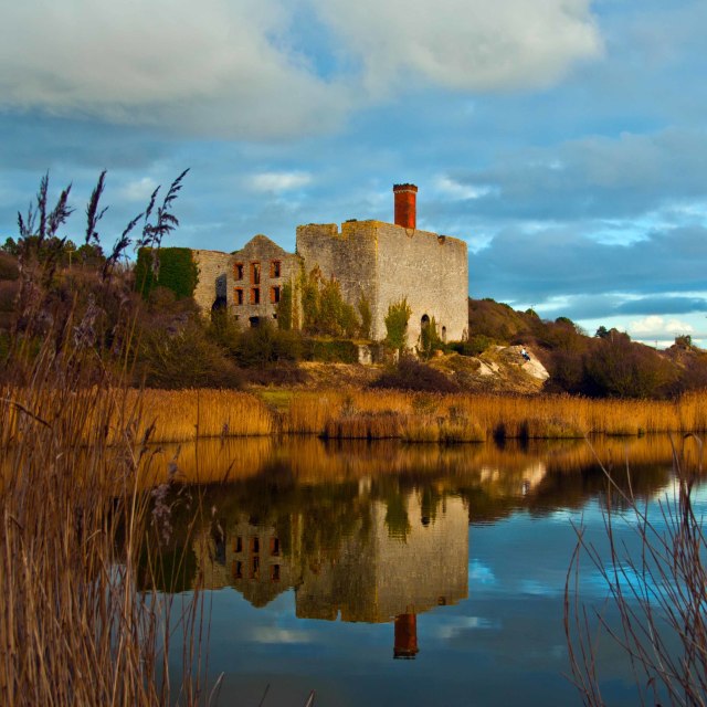 "An old lime kiln next to a small lake at Aberthaw, Vale of Glamo" stock image