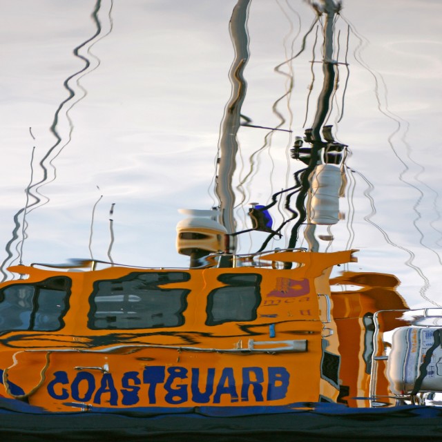 "Coastguard boat reflection" stock image