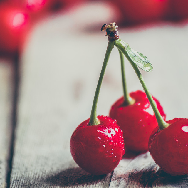 "Cherries on wooden background" stock image