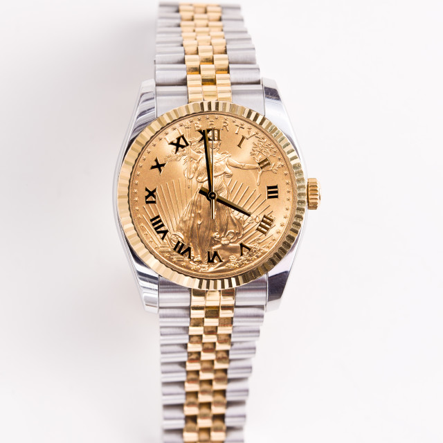 "Gold and stainless steel mans watch" stock image