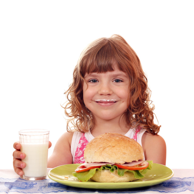 "besmear little girl with big sandwich" stock image