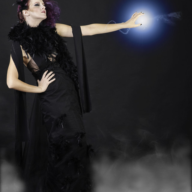 "Witch casting a spell" stock image