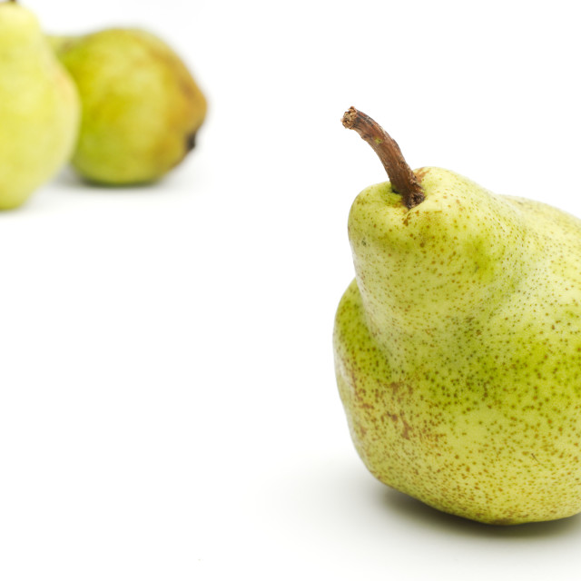 "Three Williams sort pears isolated against white background selective focus" stock image