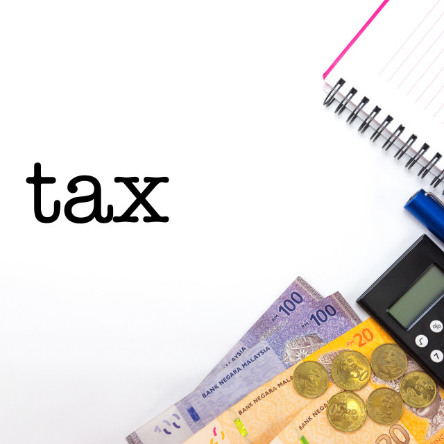 "Word tax. Malaysia Money with Calculator Pen and Notebook" stock image