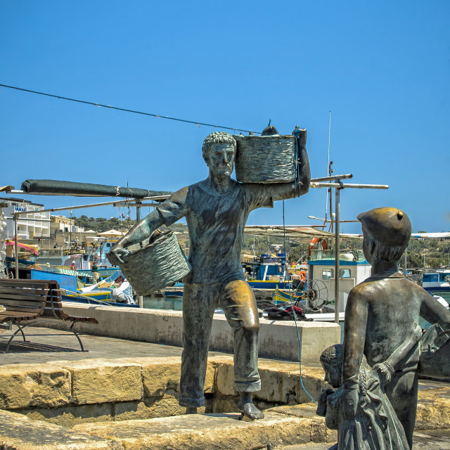 "Fisherman statue" stock image