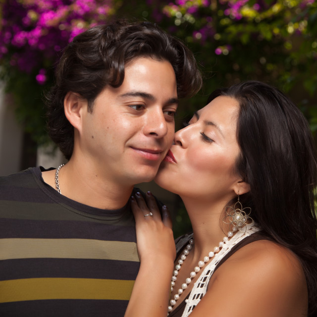 "Happy Attractive Hispanic Couple Enjoying Themselves At The Park.&quo...