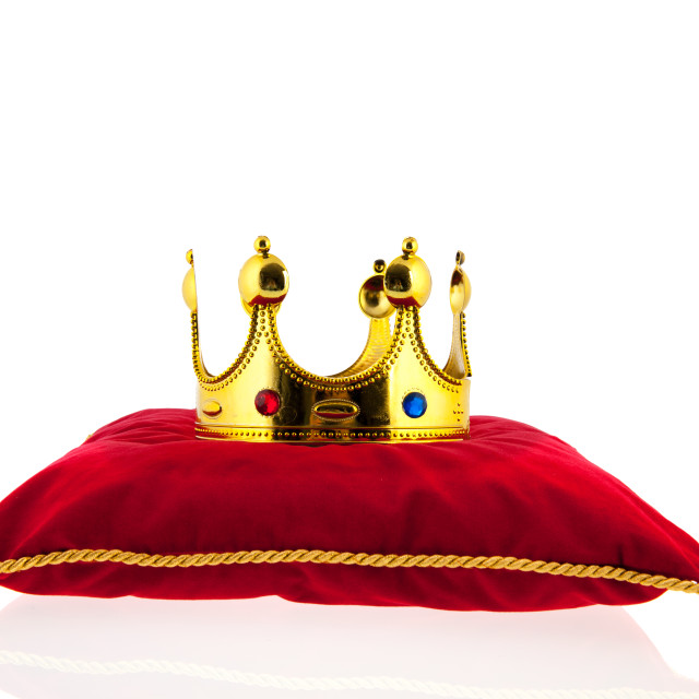 "Golden crown on velvet pillow" stock image