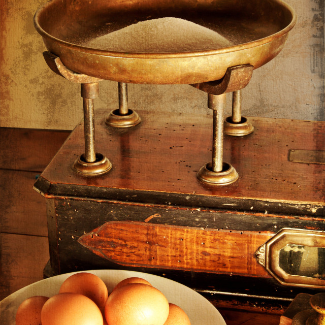 "Close-up on vintage scales and ingredients for a cake: sugar and eggs...." stock image